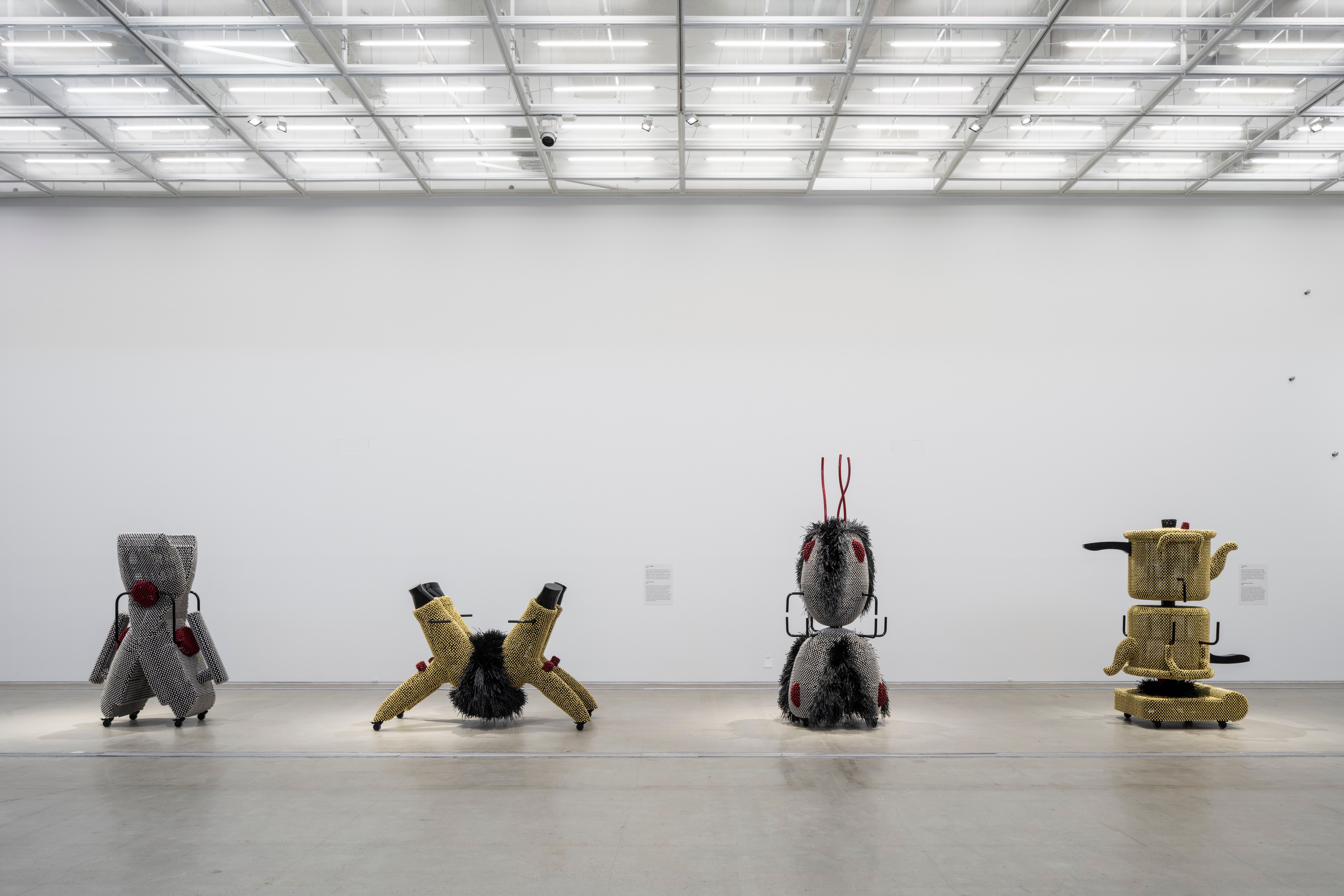 Art installation of silver and gold metallic objects resembling toys arranged in an exhibition at MMCA Seoul.