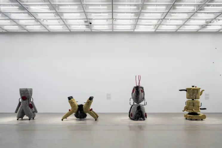 Art installation of silver and gold metallic objects resembling toys arranged in an exhibition at MMCA Seoul.