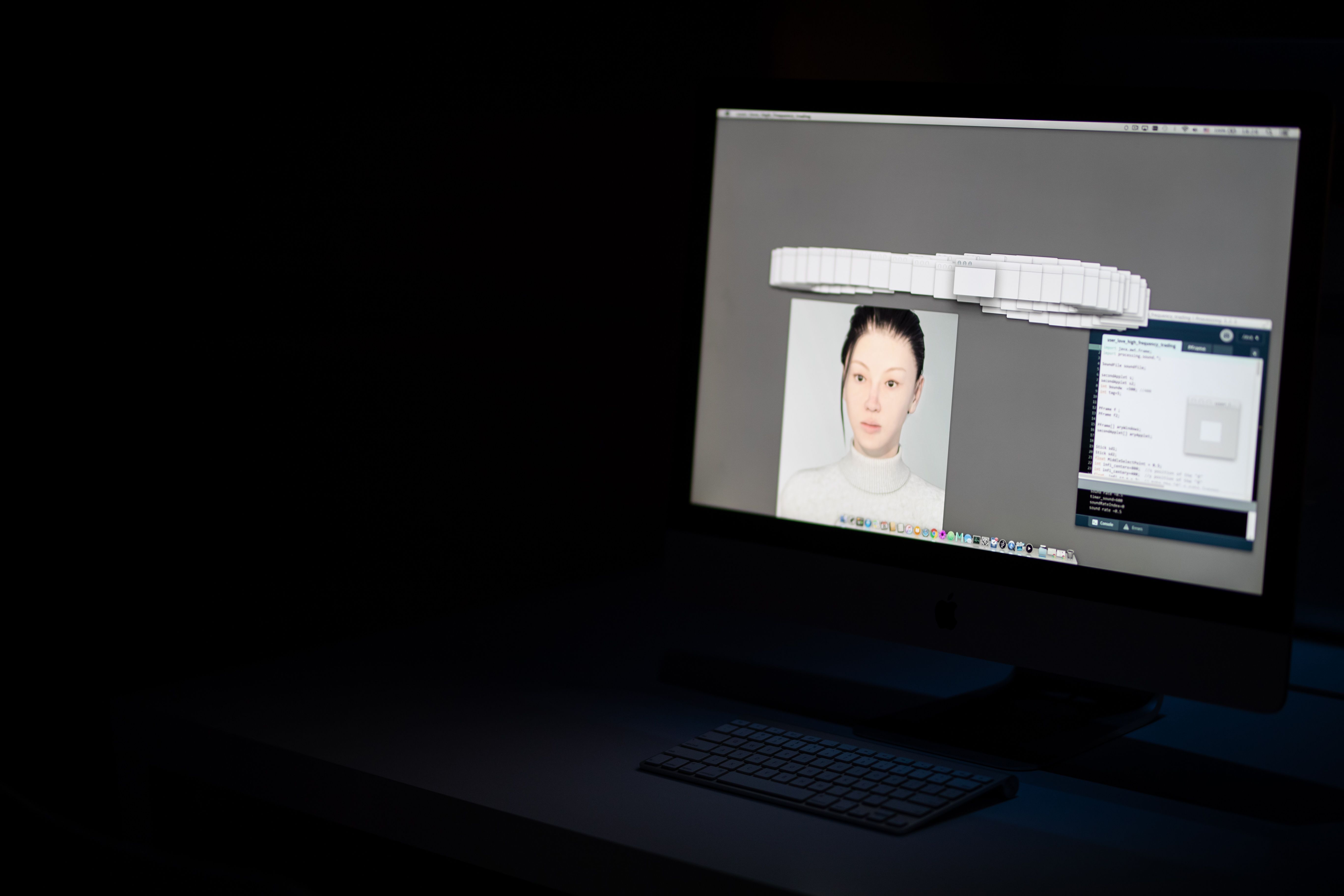 Computer screen with a 3D model of a face and keyboard.
