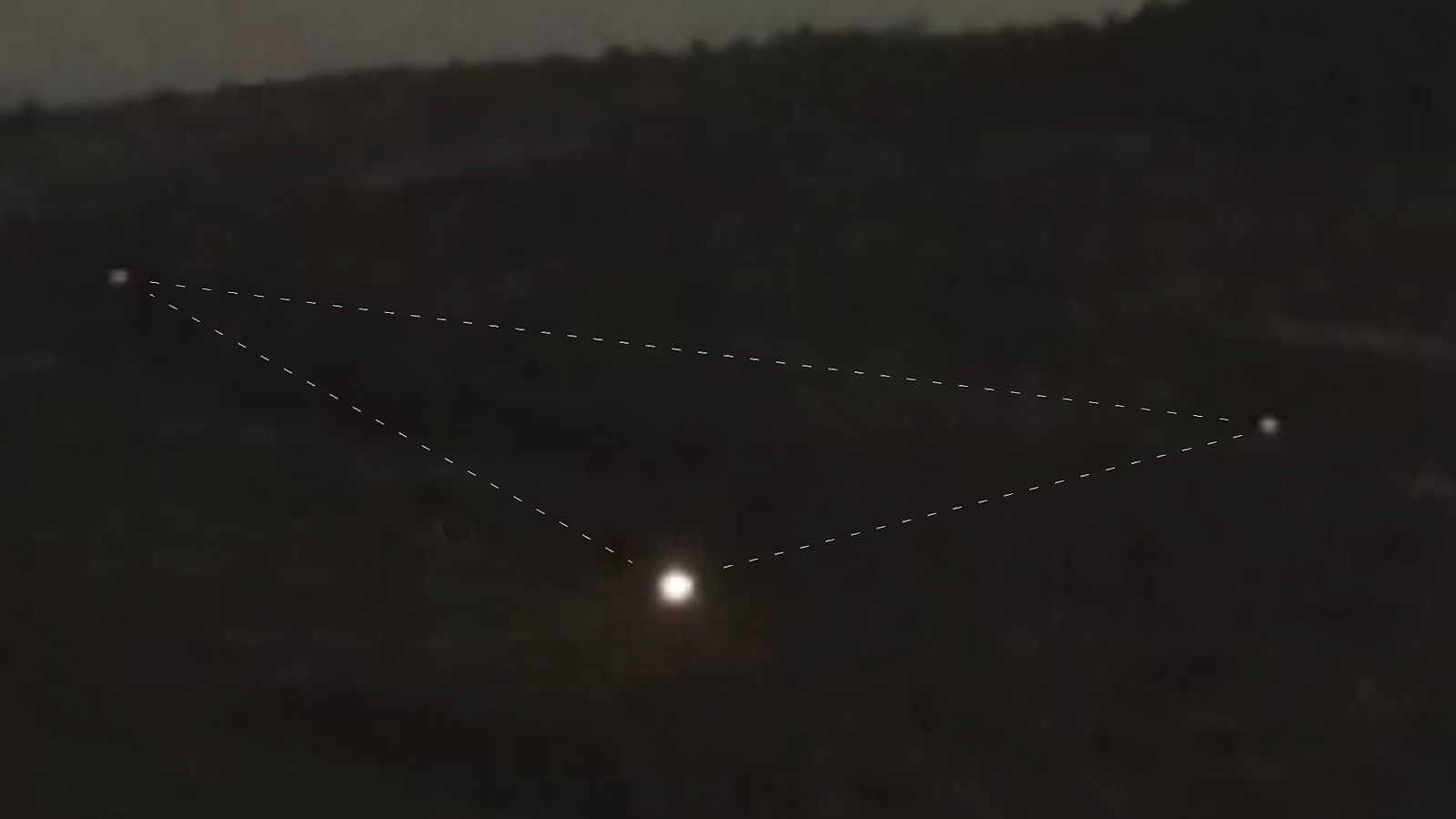 A black and white diagram displays three glowing dots, interconnected by dotted lines, against a blurred backdrop of a gra...