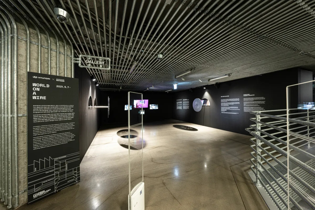 A spacious gallery hall showcasing various art installations in Seoul.