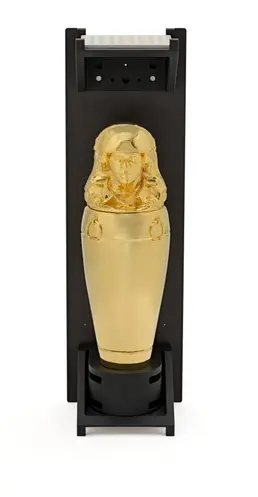A gold statue displayed in a black casing, emanating a striking contrast that accentuates its intricate design and glossy ...