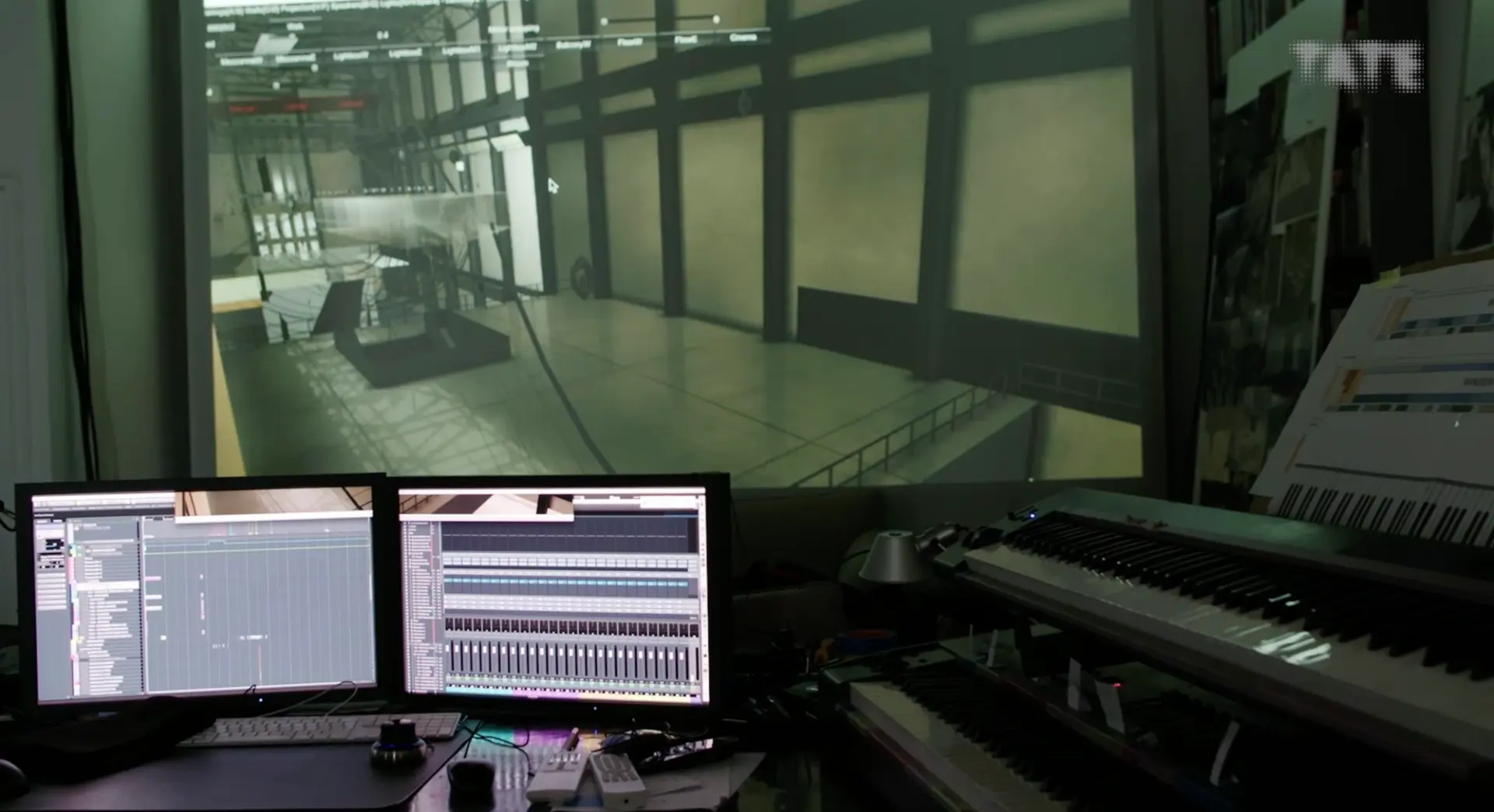 A recording studio with two computer screens showcasing music software, accompanied by music keyboards. A transparent glas...