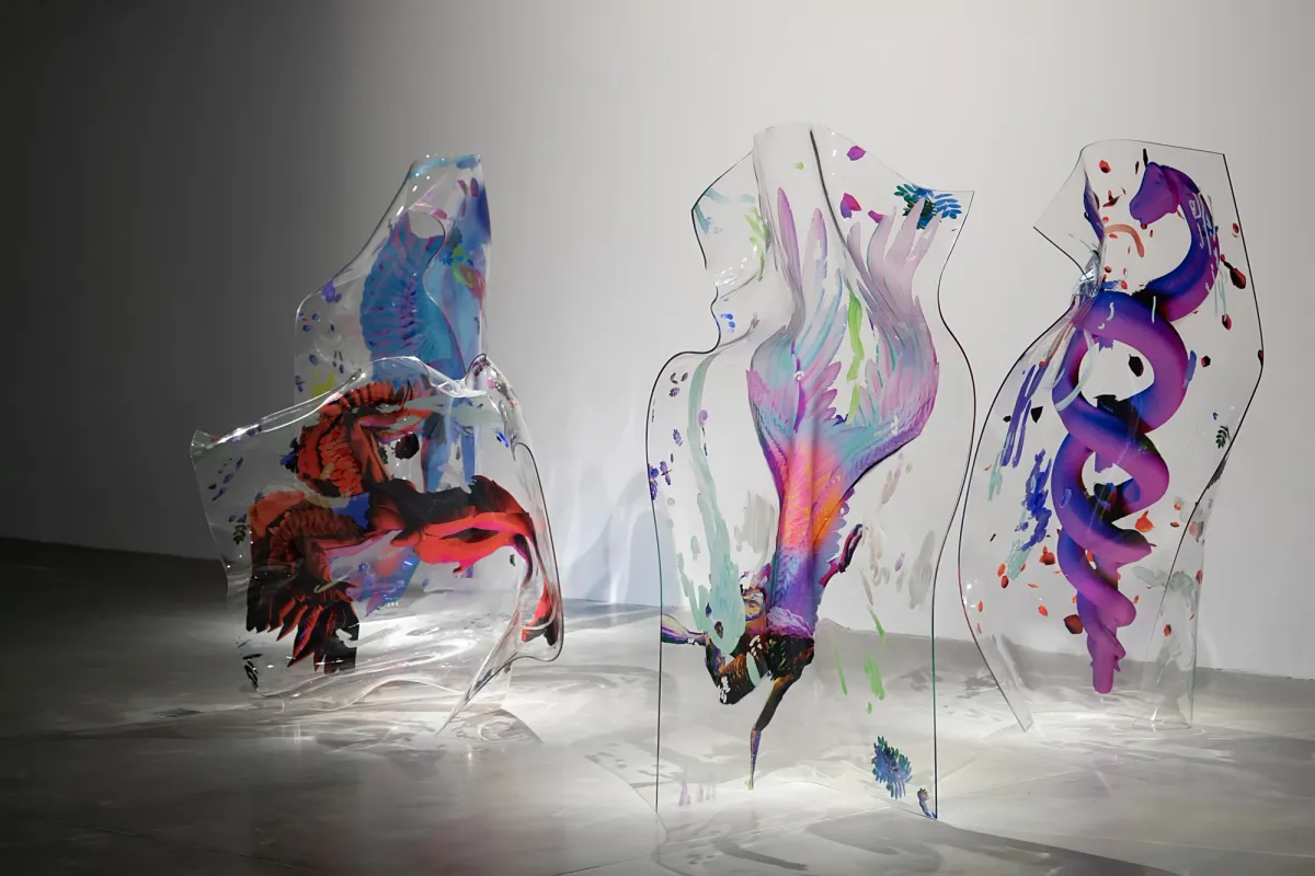 Transparent water-colored shapes crafted from plastic float against a light grey backdrop.