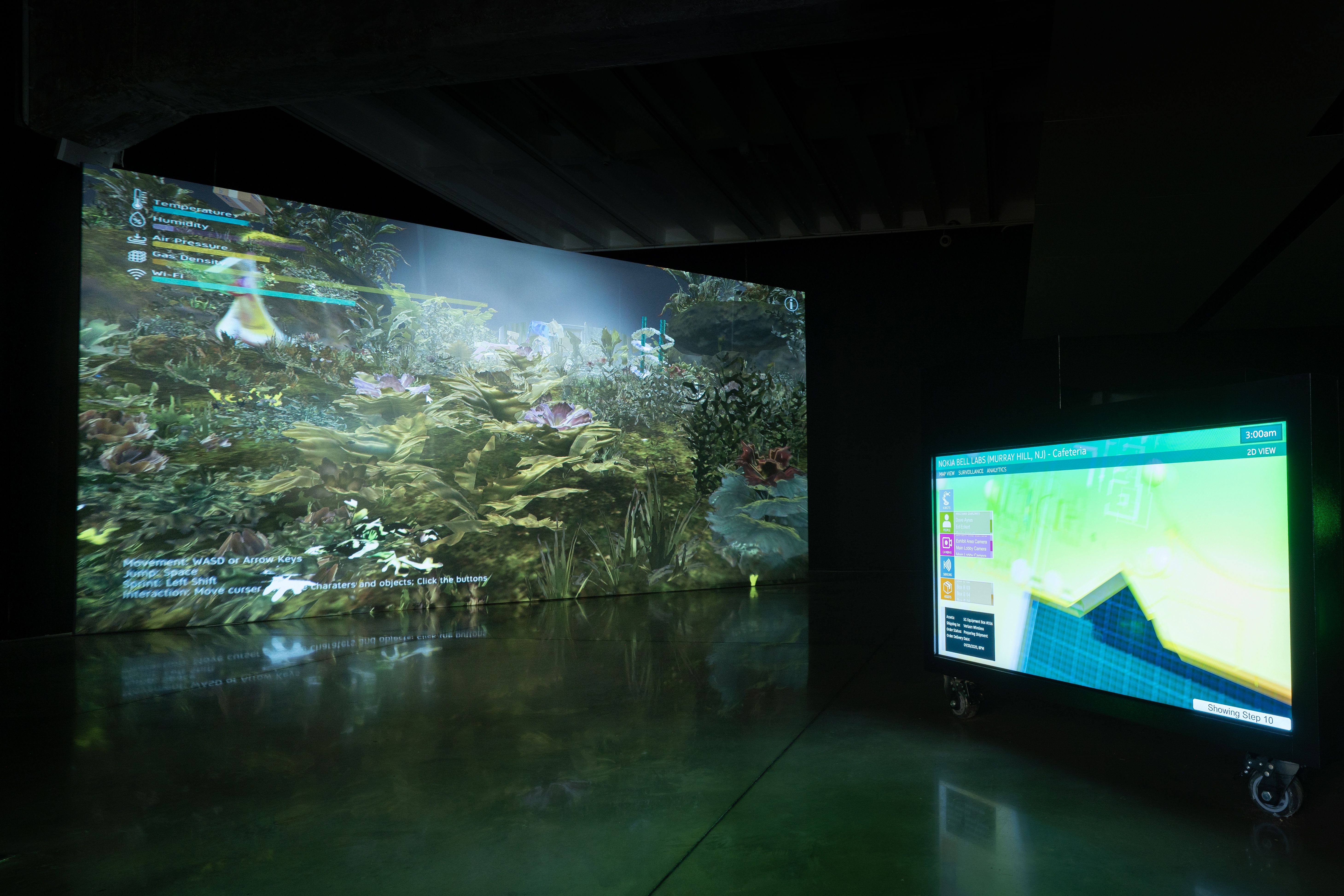 Digital art installation displaying a lush virtual garden on a large screen, with a mobile monitor showing a 2D map layout.