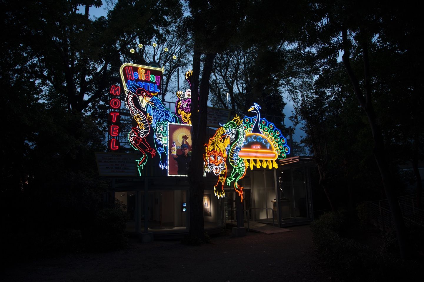 A night view of an art installation on the roof of Korea's national pavilion. The installation features a collection of fl...