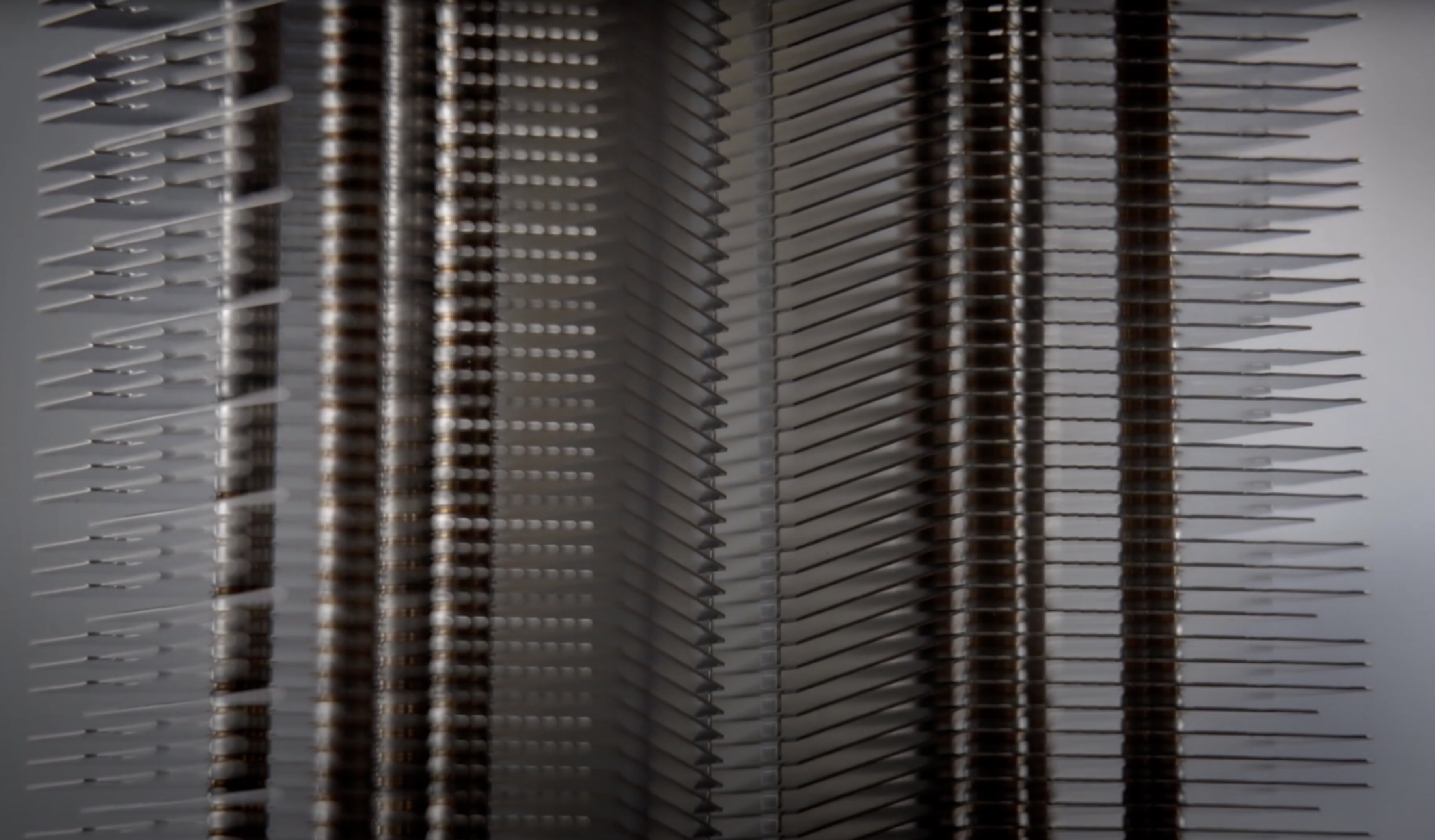 A solar-powered SunGlacier device is mounted on a wall with horizontal lines that create intriguing patterns. The lines ca...