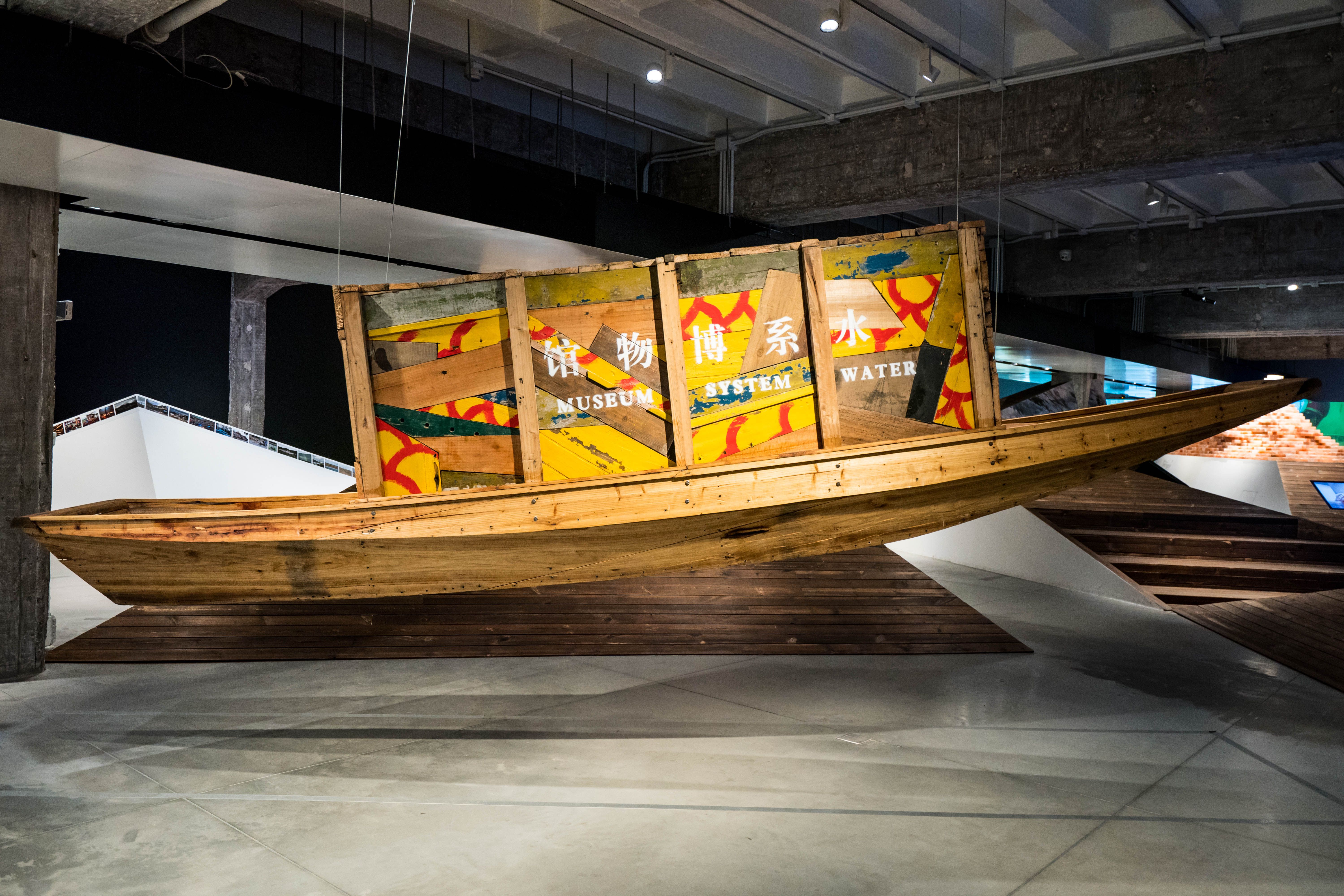 Wooden boat installation with colorful painted panels.