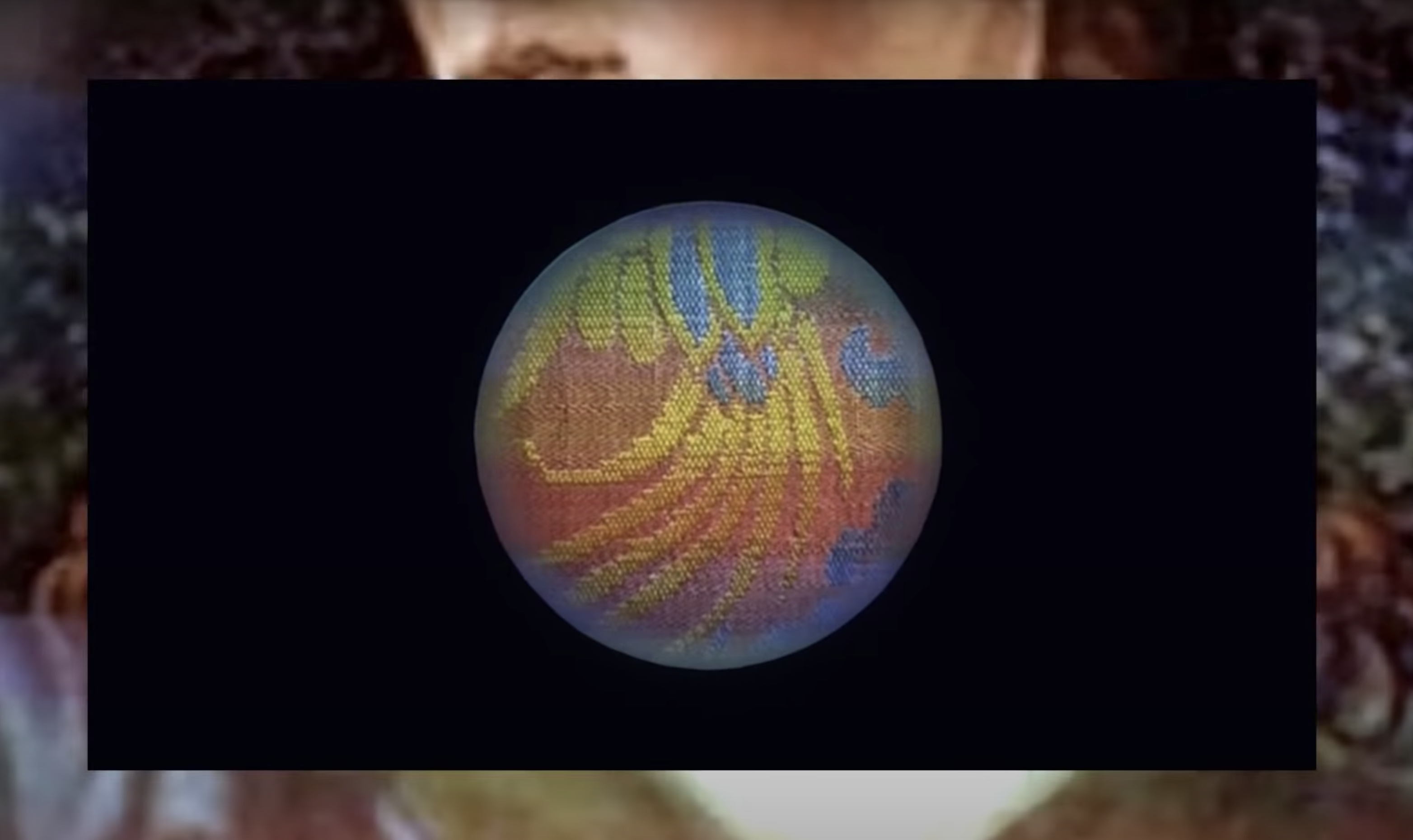 Tapestry-inspired circular design on a black background, superimposed over a larger, painted artwork.