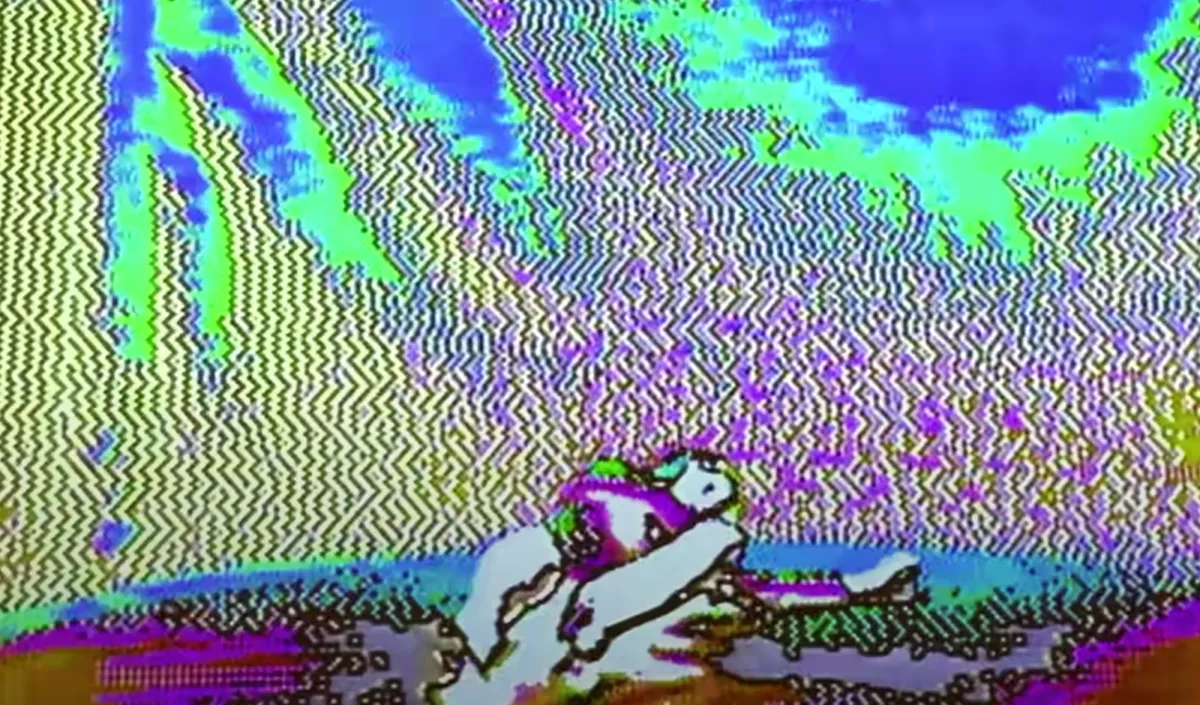 A digital image with vibrant pixel art style, possibly a negative of a photo. The primary focus is the figure of a person lying down in the middle bottom section of the image, surrounded by an array of bright colors.