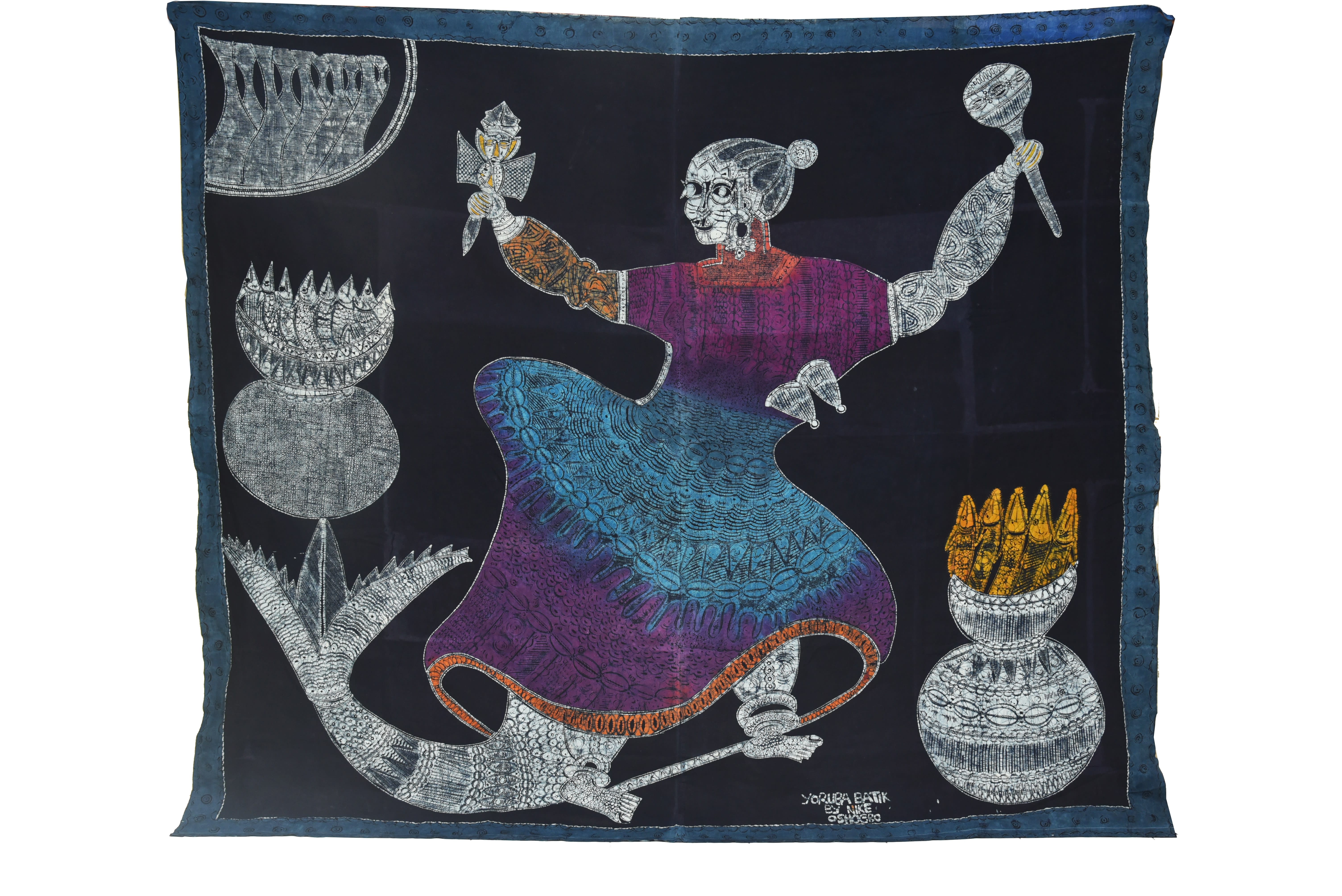 A traditional batik textile featuring intricate designs and cultural motifs in vibrant colors.