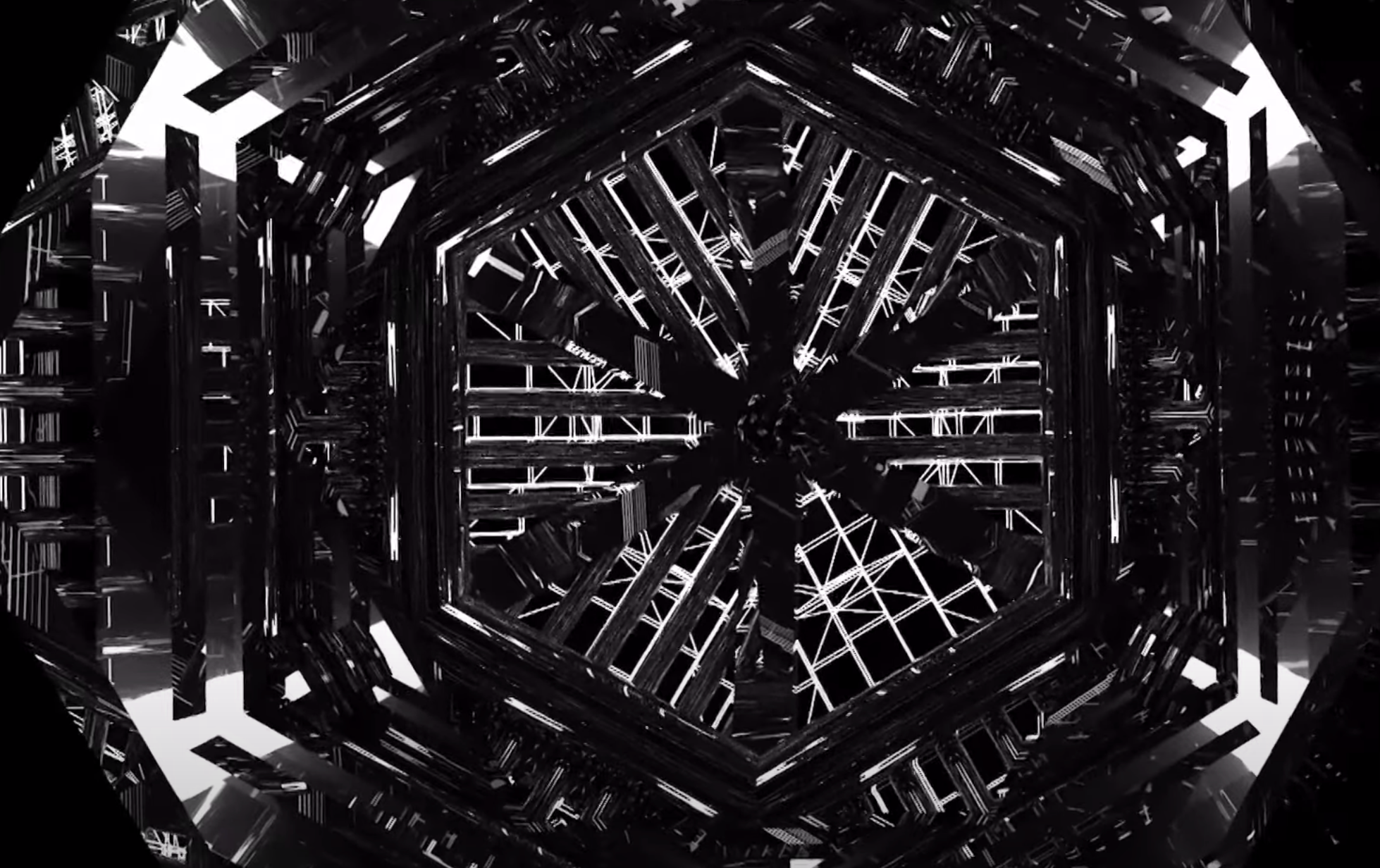 A massive, black iron portal with rivets and paneling stands in an industrial setting. It showcases an intricate design, a...
