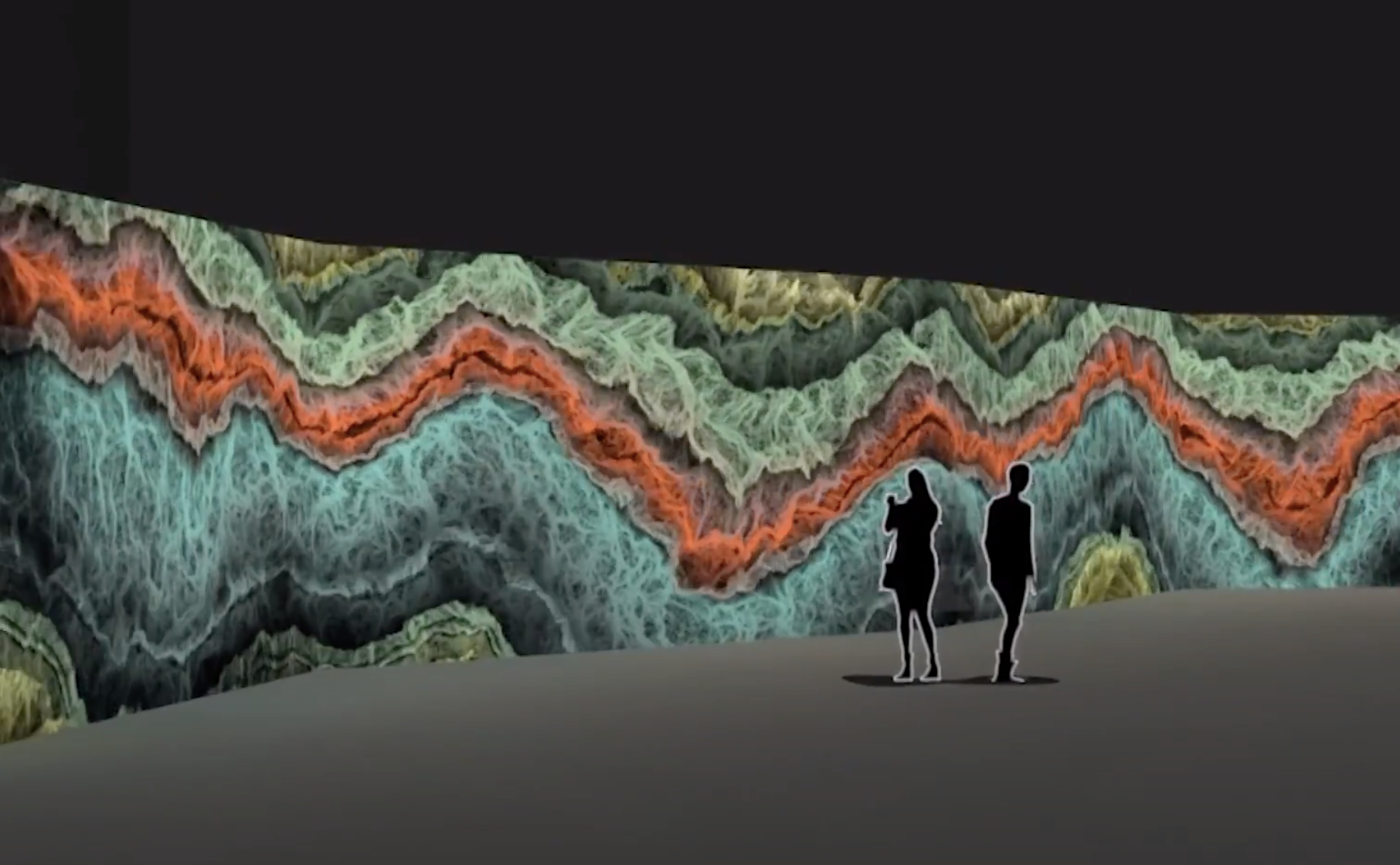 An expansive art graphic depicting waves in shades of green, aqua blue, and orange stretches along a wall. The grey floor ...