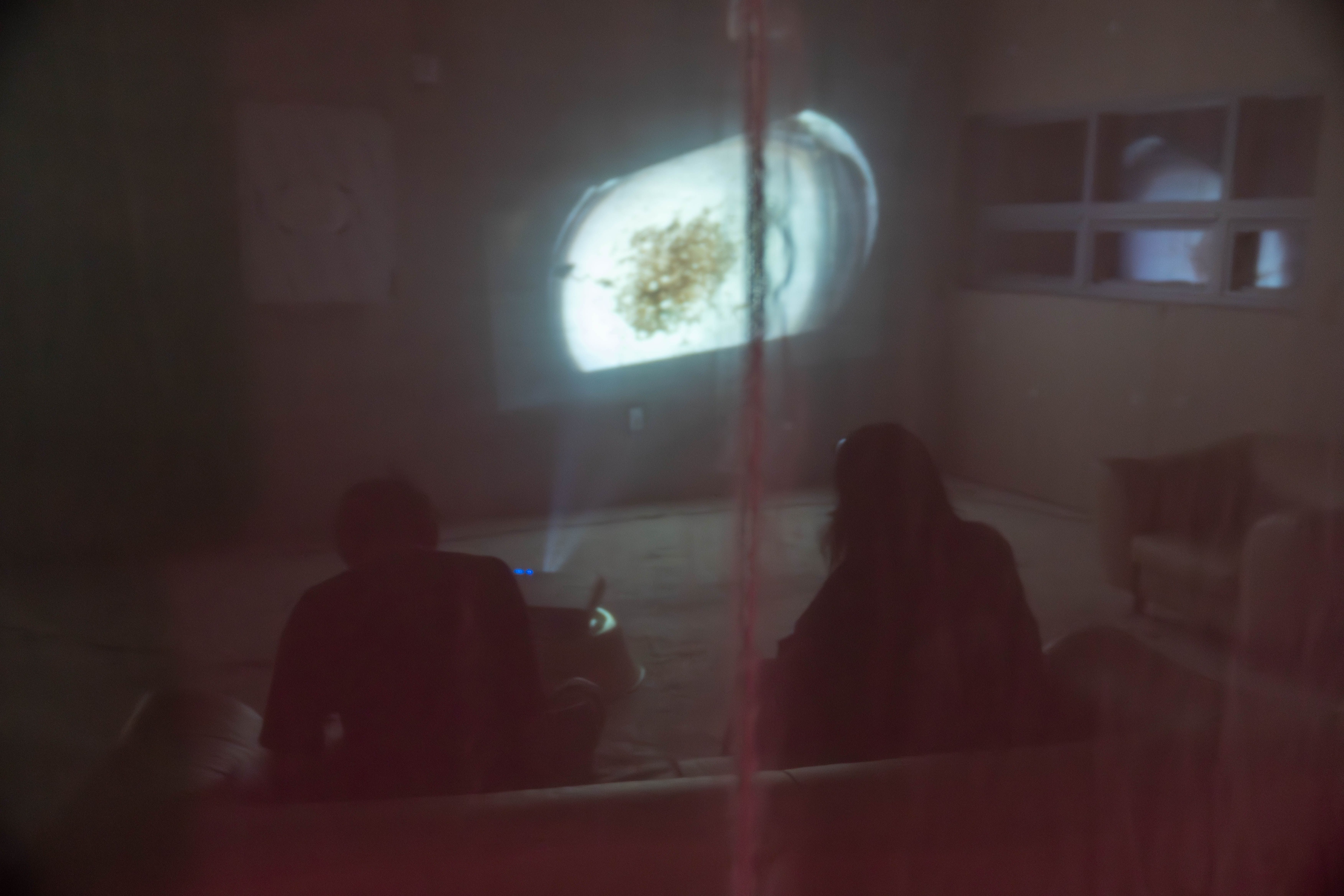 Museum visitors watch a video projection at MMCA.