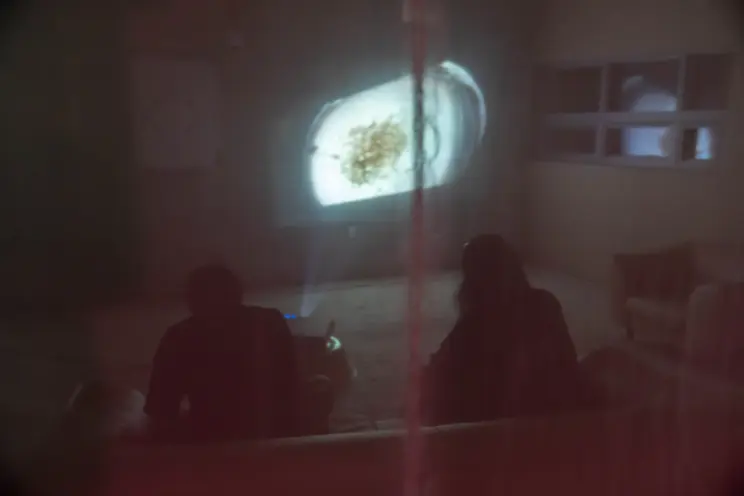 Museum visitors watch a video projection at MMCA.