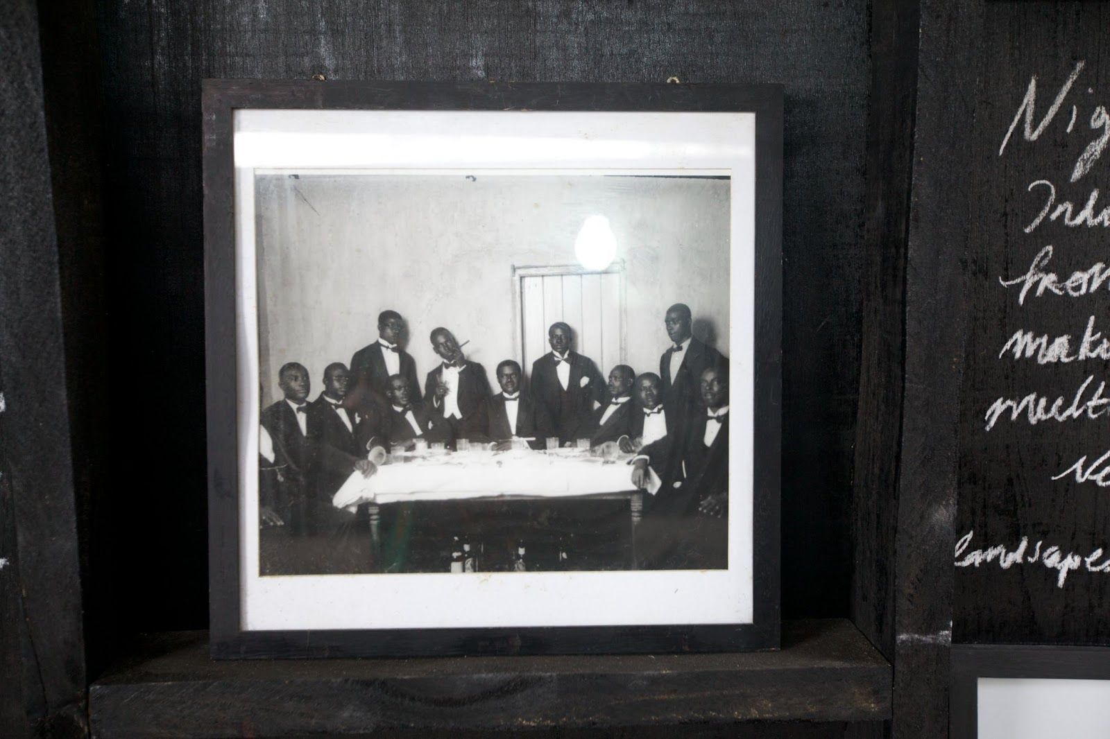 A cultural data collection kiosk in Accra, Ghana displays a black and white photograph within a frame. The photograph feat...