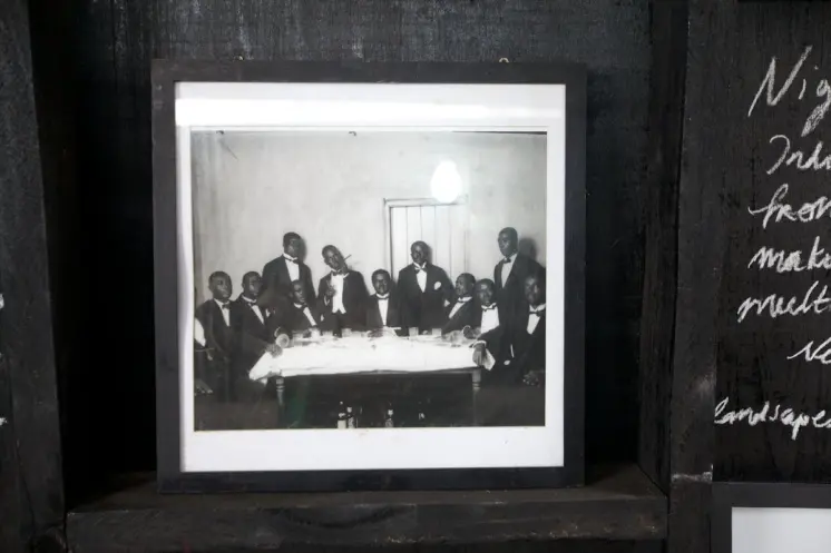 A cultural data collection kiosk in Accra, Ghana displays a black and white photograph within a frame. The photograph feat...