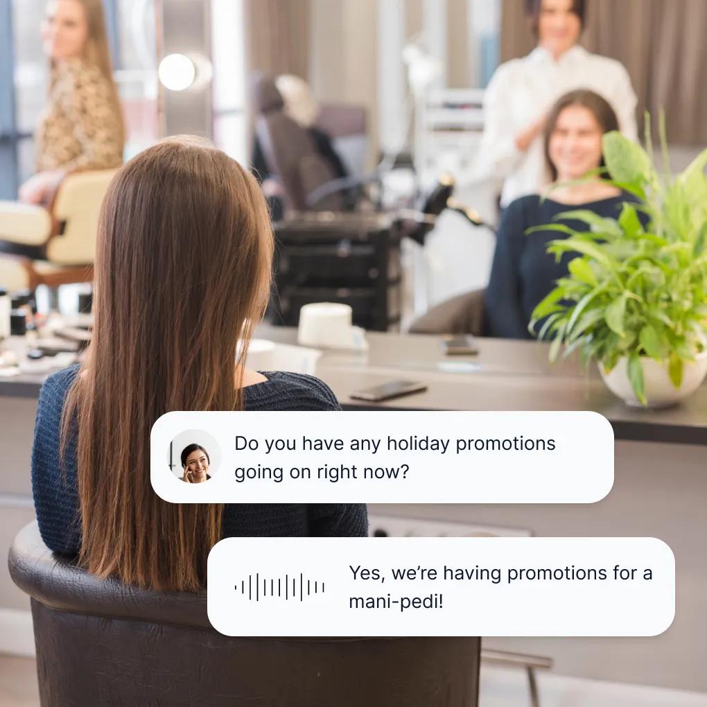Client seated in modern salon chair while answering service for beauty salon provides holiday promotion details