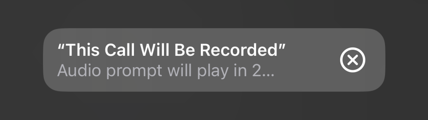 An iPhone screen showing a warning message that the phone call is being recorded before generating a phone call transcript.