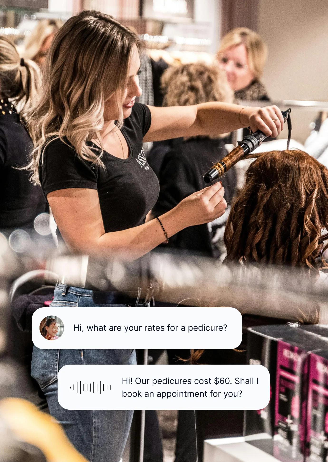 Hair stylist curling client's hair while salon answering service handles incoming call about pedicure pricing and appointment booking