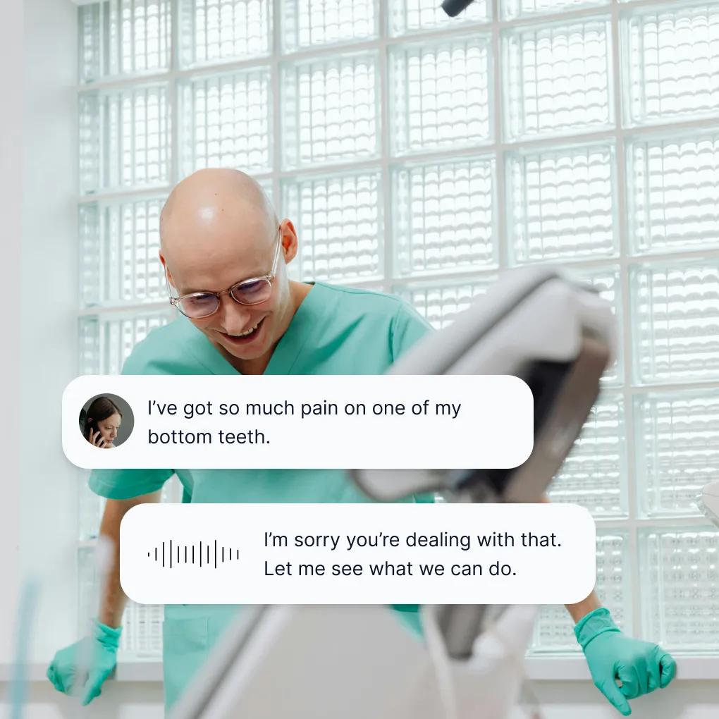 Dentist in scrubs reviewing patient information while responding to an emergency dental pain inquiry through a 24-hour answering service