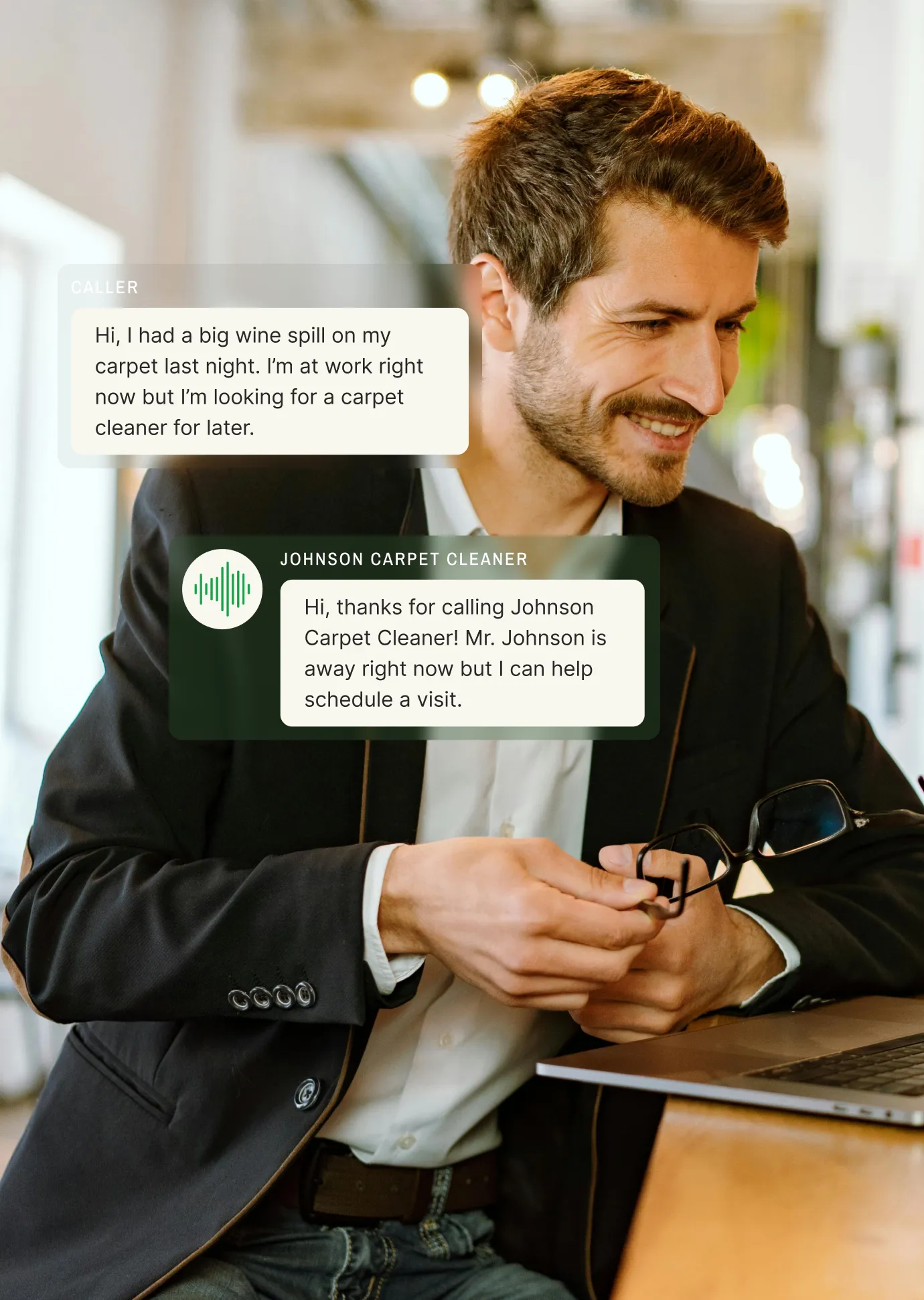 A business professional sits at a desk using a laptop to transcribe a voicemail about scheduling a carpet cleaning appointment for a wine spill cleanup.