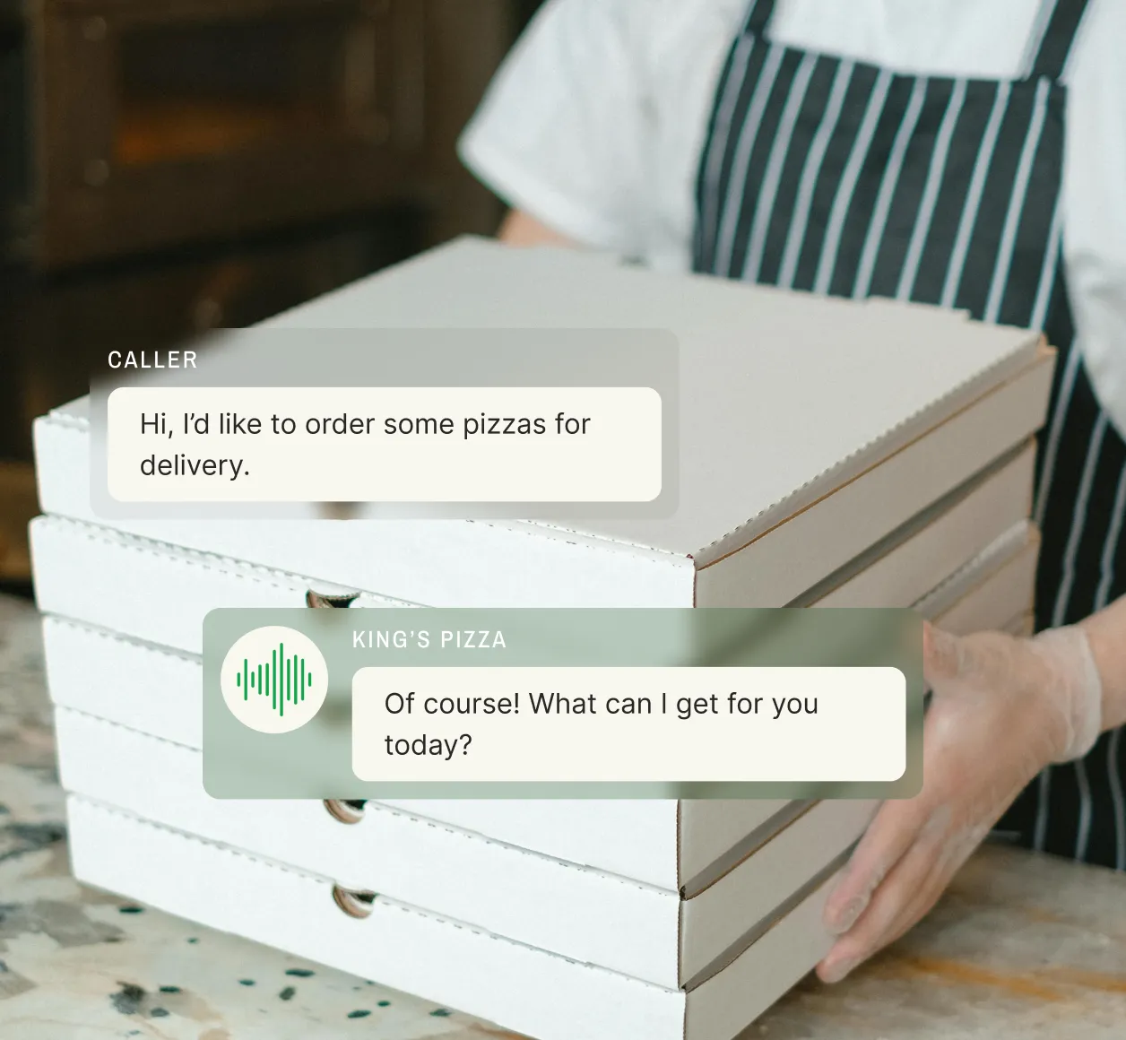 A pizza franchise employee holds boxes while a franchise answering service processes delivery orders seamlessly.
