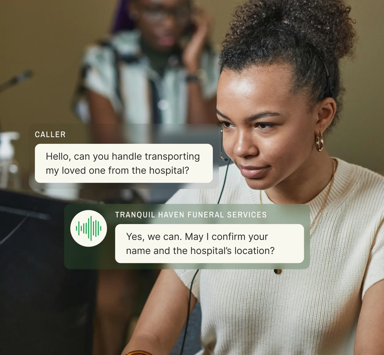 A funeral call answering service representative wearing a headset listens attentively as a caller inquires about hospital transport for a deceased loved one, with the representative confirming they can assist.