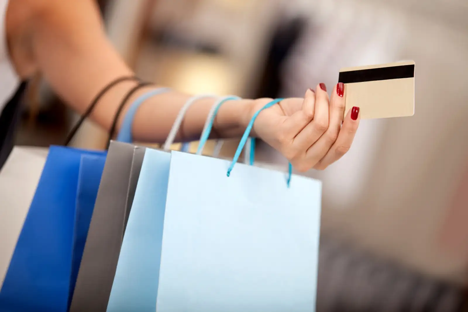 Woman shopping and paying with a debit or credit card.jpeg