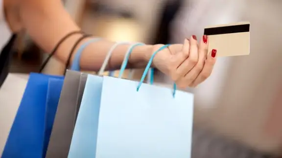 Woman shopping and paying with a debit or credit card.jpeg