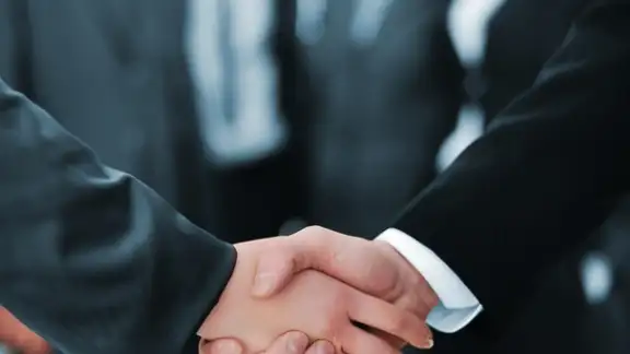 Handshake isolated on business background.jpeg