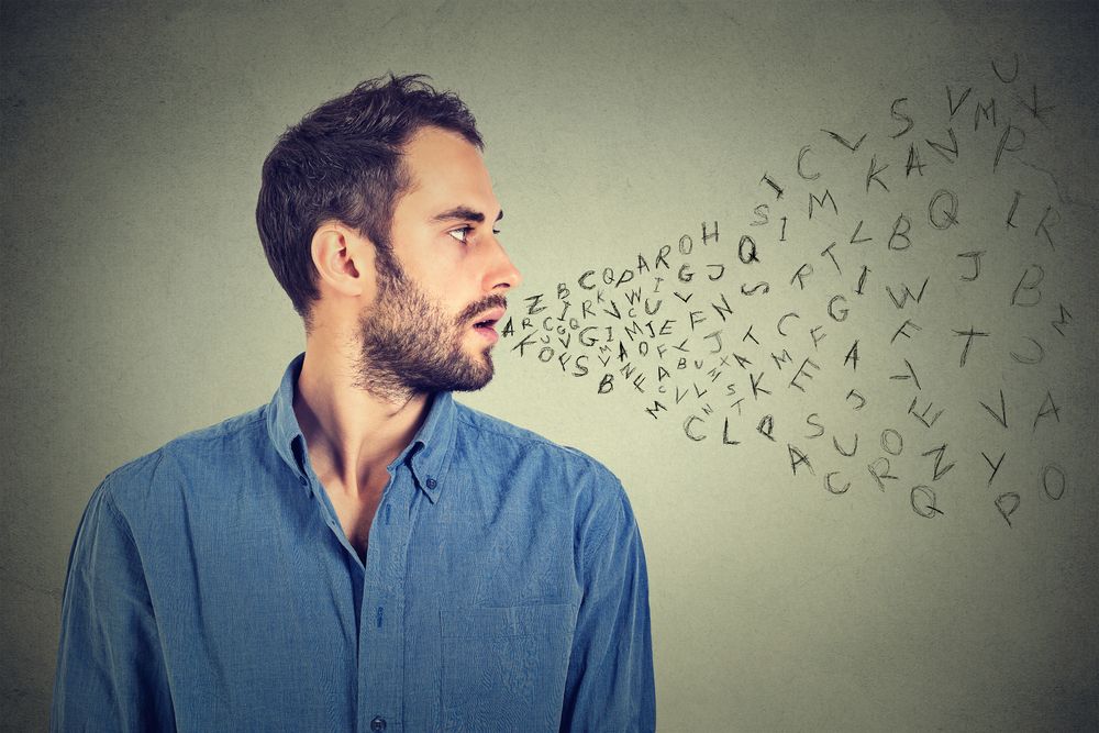 Man talking with alphabet letters coming out of his mouth. Communication%2c information%2c intelligence concept.jpeg