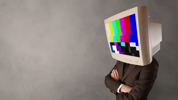 Young person with monitor head with no channel concept.jpeg