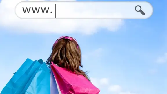 Girl holding shopping bags with address bar above against a blue sky.jpeg