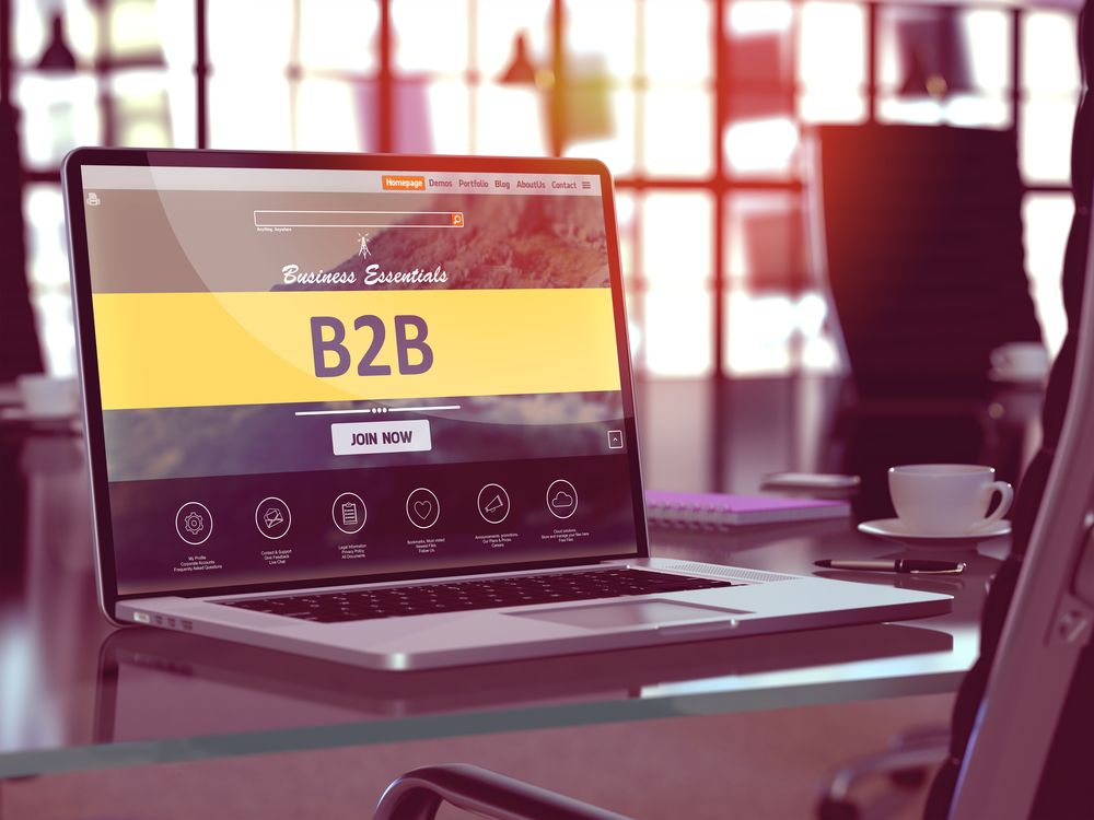 B2B - Business to Business - Concept - Closeup on Laptop Screen in Modern Office Workplace. Toned Image with Selective Focus. 3d Render.-1.jpeg