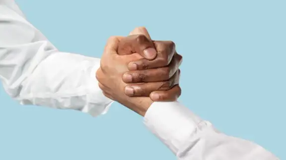 friends-greetings-sign-or-disagreement-two-male-hands-competion-in-arm-wrestling-isolated-on-blue-studio-background-concept-of-standoff-support-friendship-business-community-strained-relations.jpg