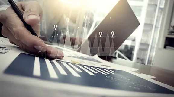 business documents on office table with smart phone and digital tablet and graph financial with social network diagram and man working in the background.jpeg