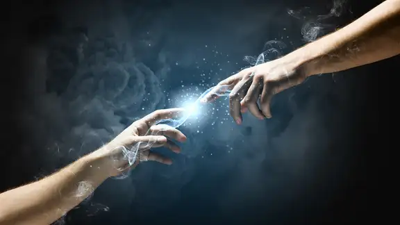 Michelangelo Gods touch. Close up of human hands touching with fingers.jpeg