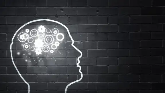 Silhouette of human head with gears mechanism instead of brain.jpeg