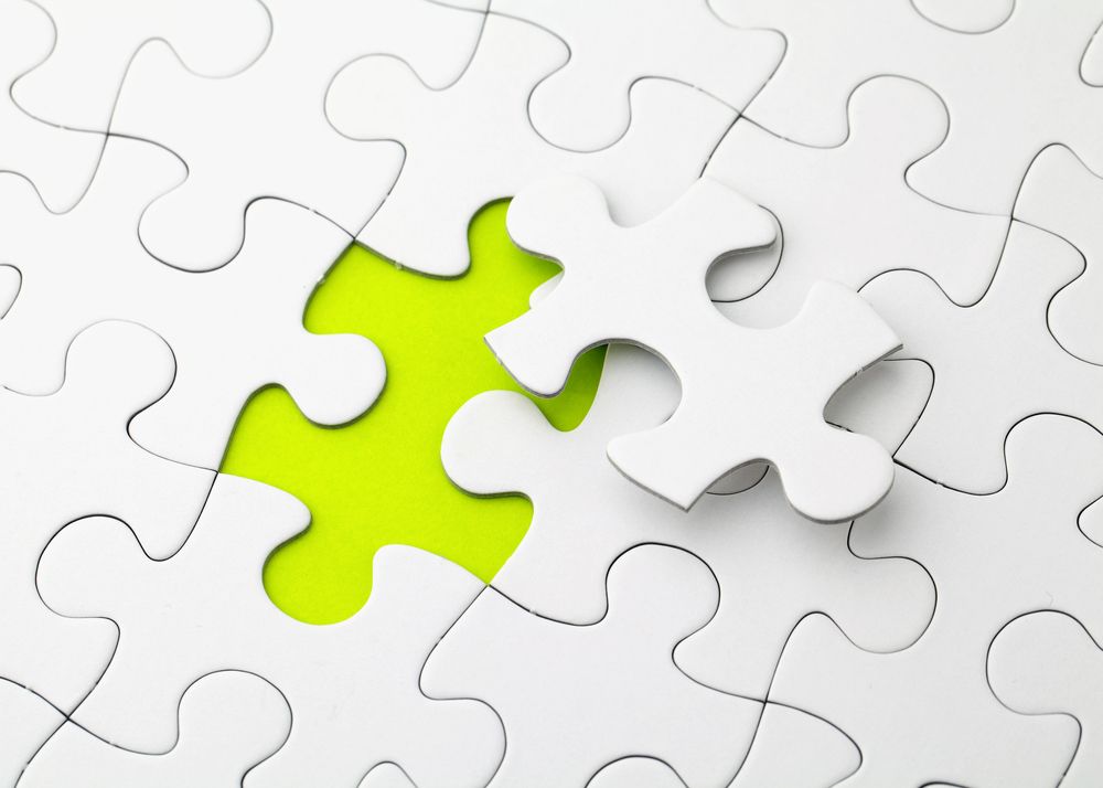 Puzzle with missing piece in green color.jpeg