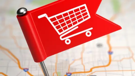 Shopping Concept - Small Flag on a Map Background with Selective Focus.-1.jpeg