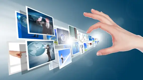 Hand touches the flow of images. Symbol of media streams.jpeg
