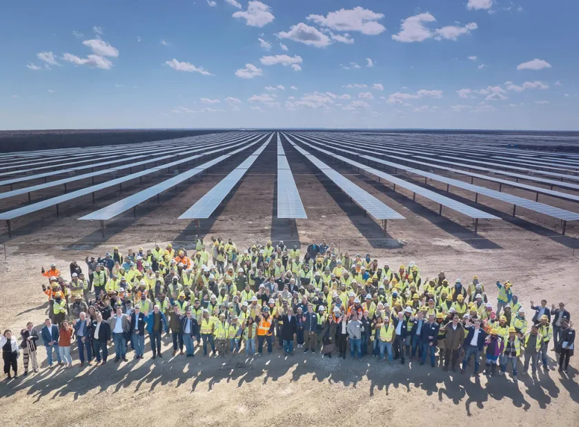 Avantus construction crew photo posing in front of a large solar installation