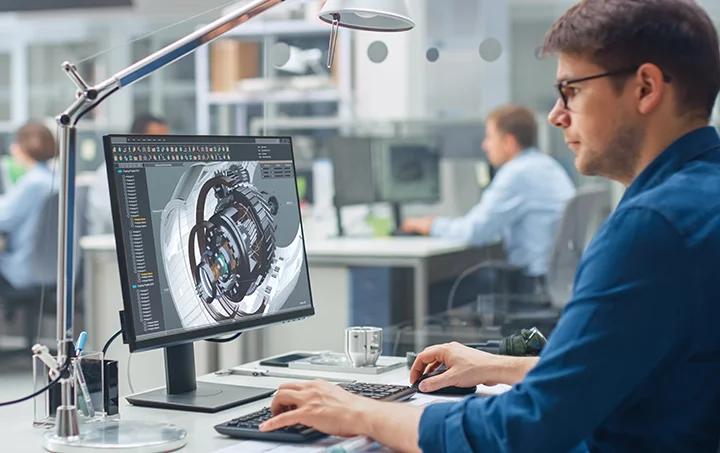 person working on a computer using 3D software