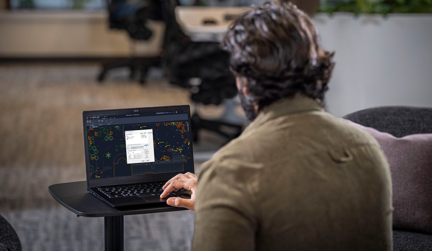 people working infront of a laptop