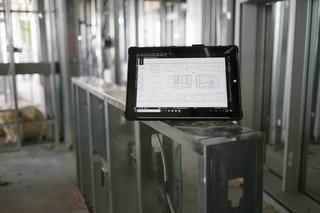 Tablet on construction site with Bluebeam open on the screen 