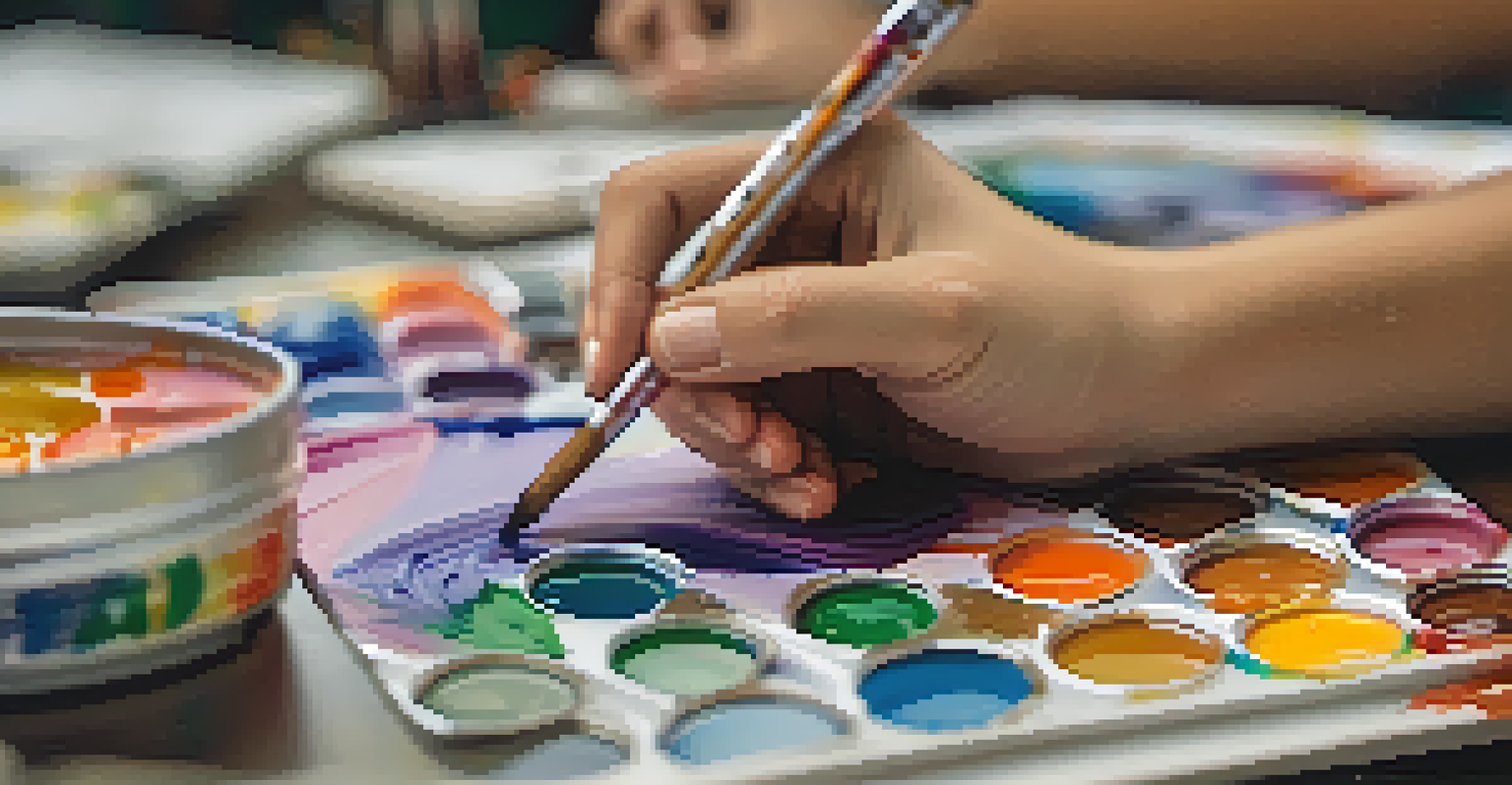 A close-up of a student's hands painting on a canvas, with other students engaged in artistic activities in a softly blurred background.