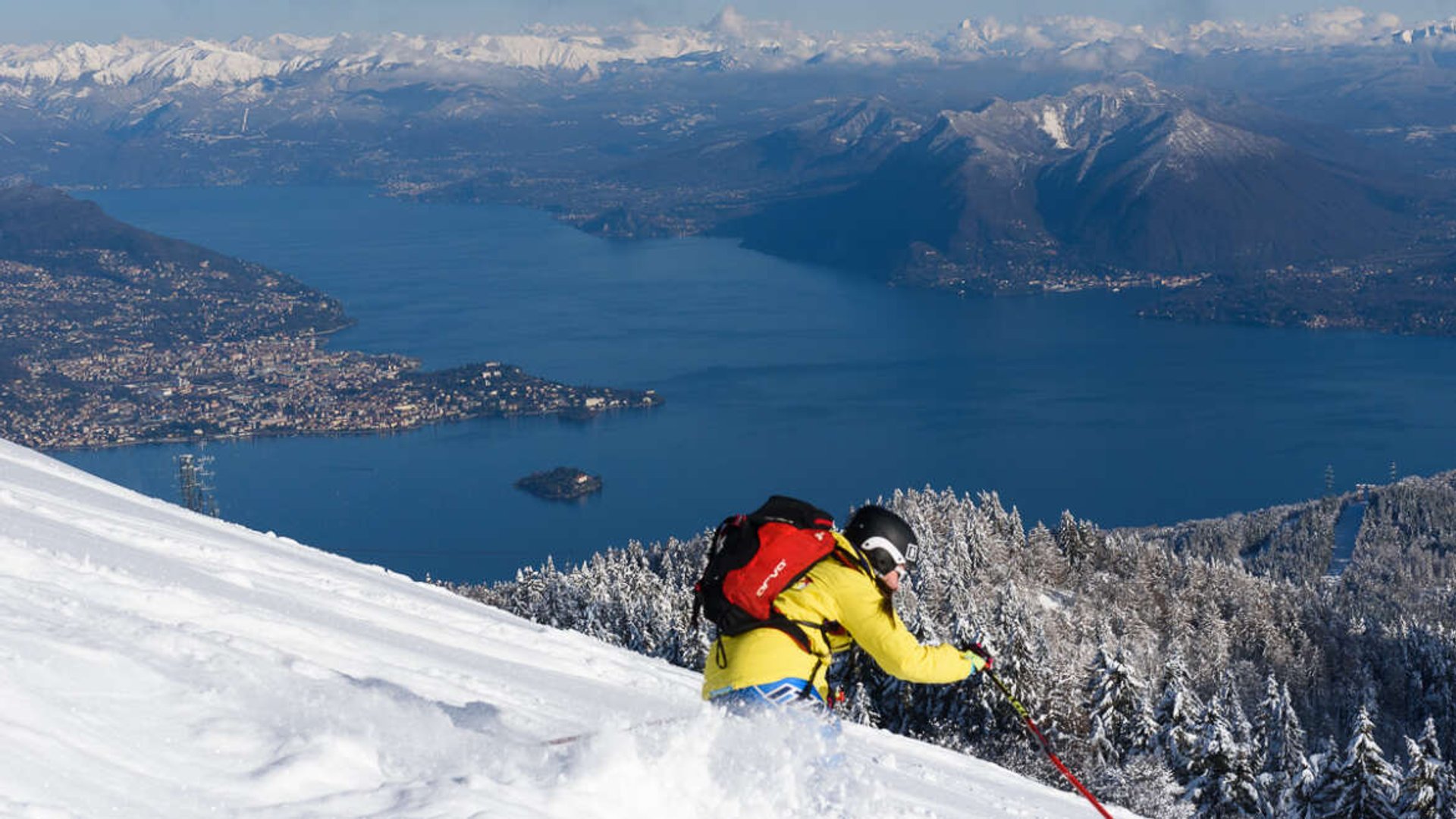 Skiing on Mottarone with panoramic view of Lake Maggiore and the Borromean Islands