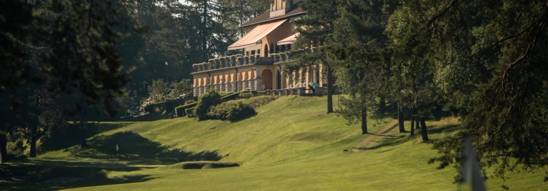 Championship fairway at Circolo Golf Villa d'Este surrounded by ancient trees