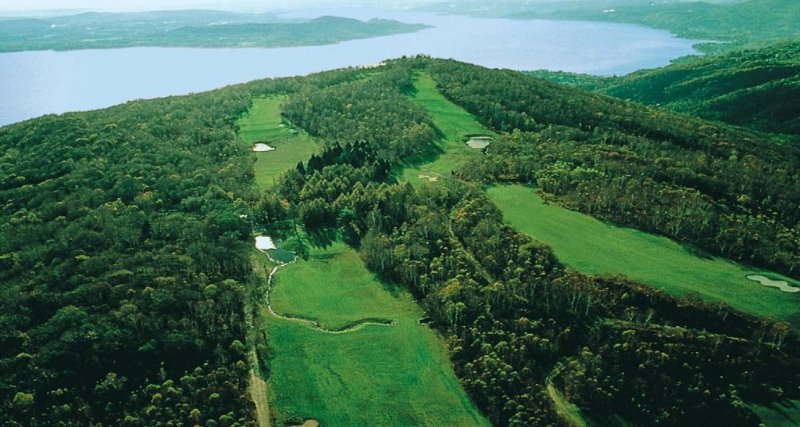 Panoramic view of a championship golf course overlooking the Italian Lakes